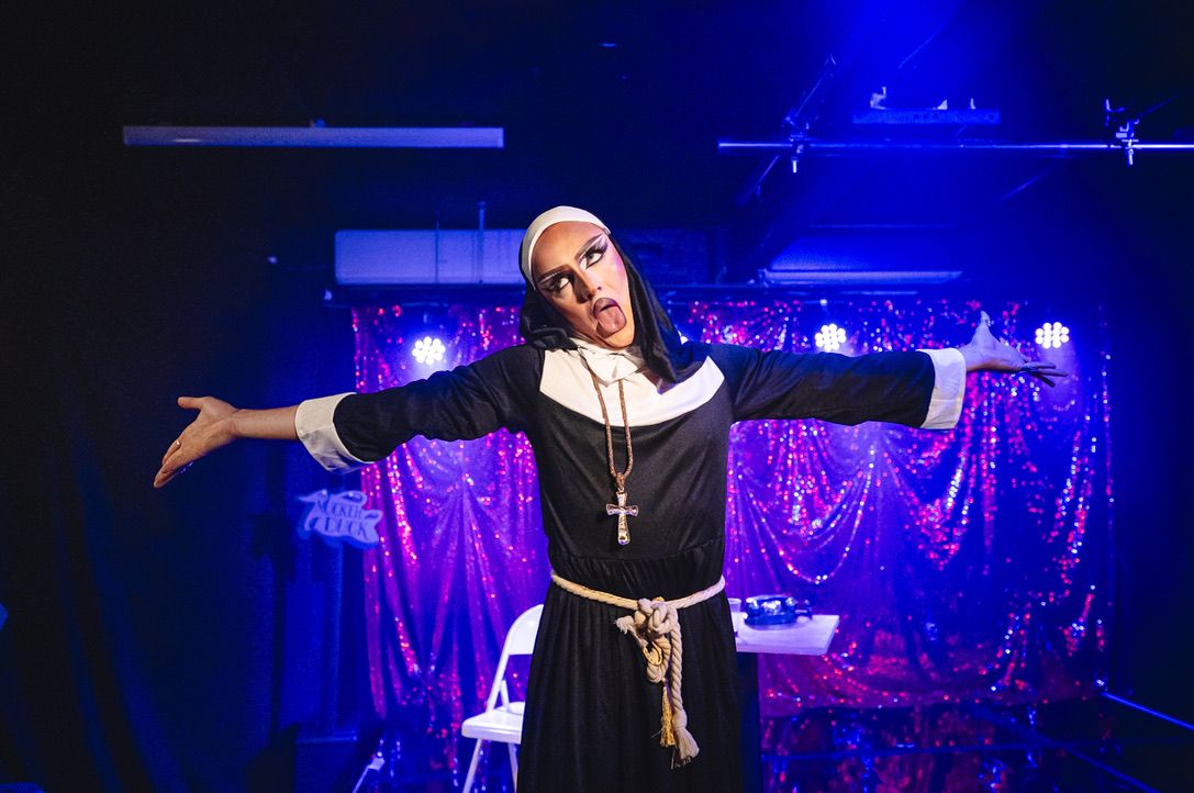 a drag performer dressed as a nun