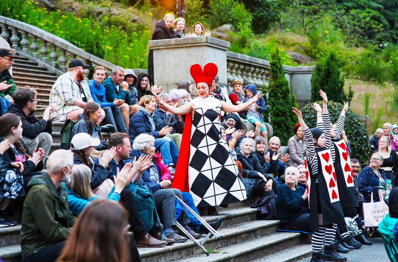 Alice in Wonderland at the Dukes. The Queen of Hearts walks through the audience and down the steps of Ashton Memorial in Williamson Park.