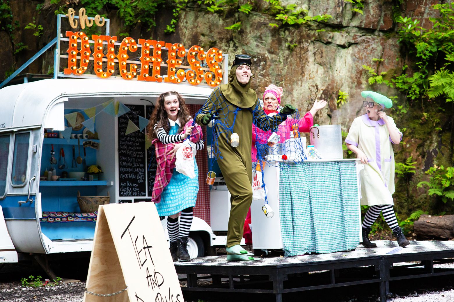 Alice in Wonderland at the Dukes. The cast in the Dell at Williamson Park with Alice, the Duchess, the Cook and the Mockturtle.