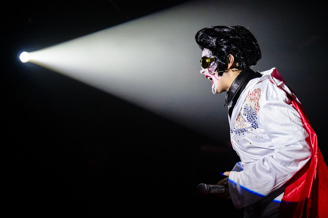 a drag performer dressed as Elvis