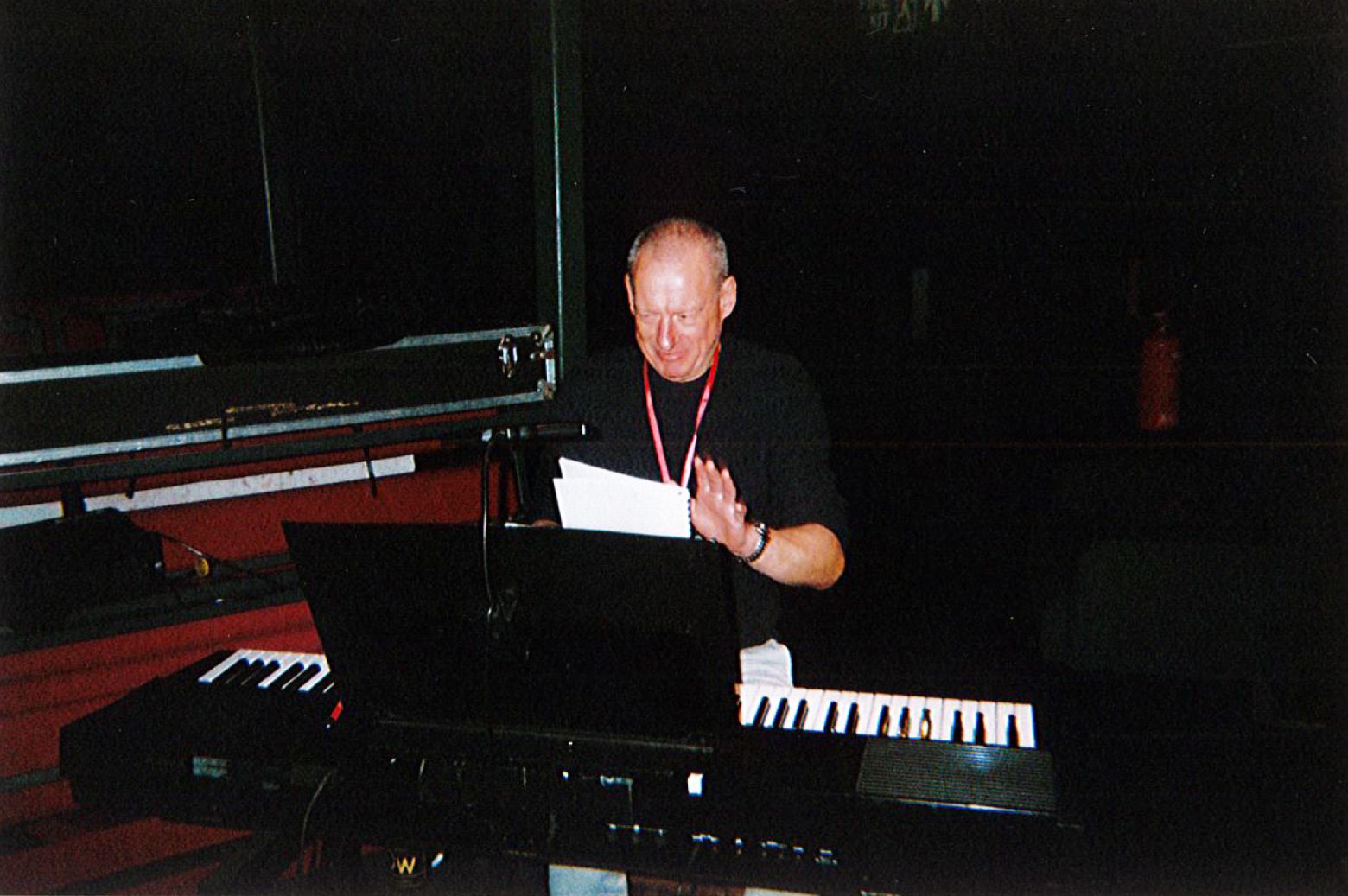 Composer Dave Bintley playing keyboard in the round theatre