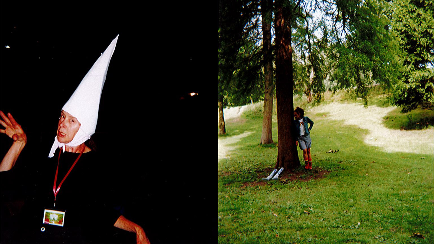 On the left, Lisa Howard, posing in a witchy way, wearing the base of the Witches pointy hat. On the right, Hope Yolanda as Dorothy, leaning against a tree, with the witches puppet legs coming from the bottom. Photo taken by The Wizard of Oz Team. 