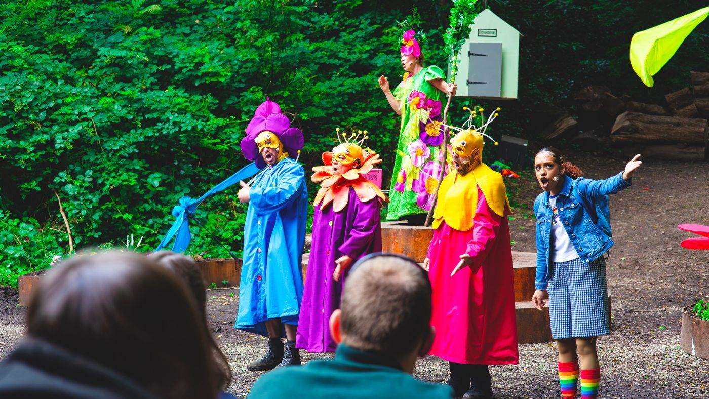 The Good Witch (Lisa Howard) surrounded by Munchkins (Helen Longworth, Gareth Cassidy and Matthew Ganley) and Dorothy (Hope Yolanda), all singing. The Wizard of Oz by the Dukes, photos by Gabi Dawkins.