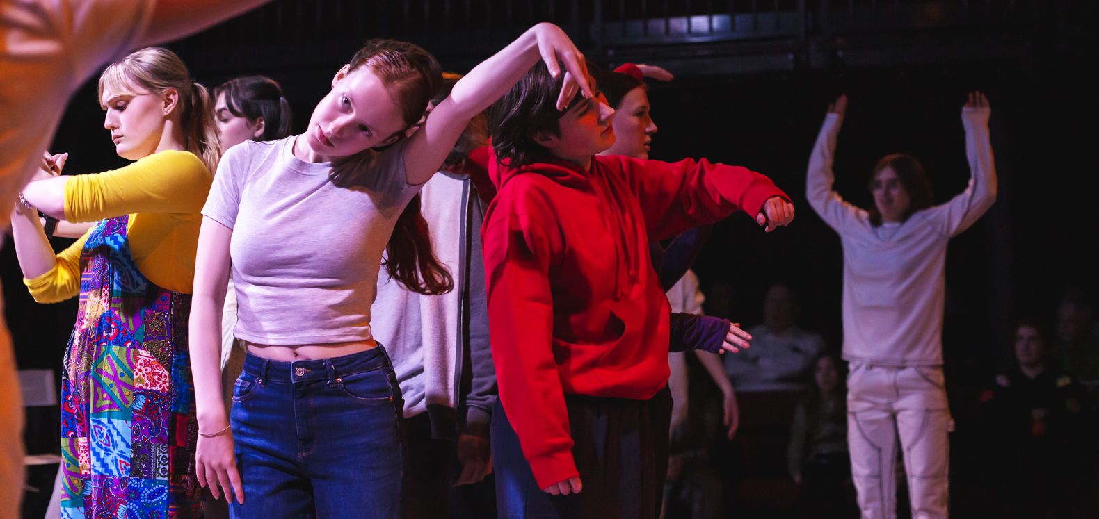 members of the Dukes Young Company engaged in a movement exercise