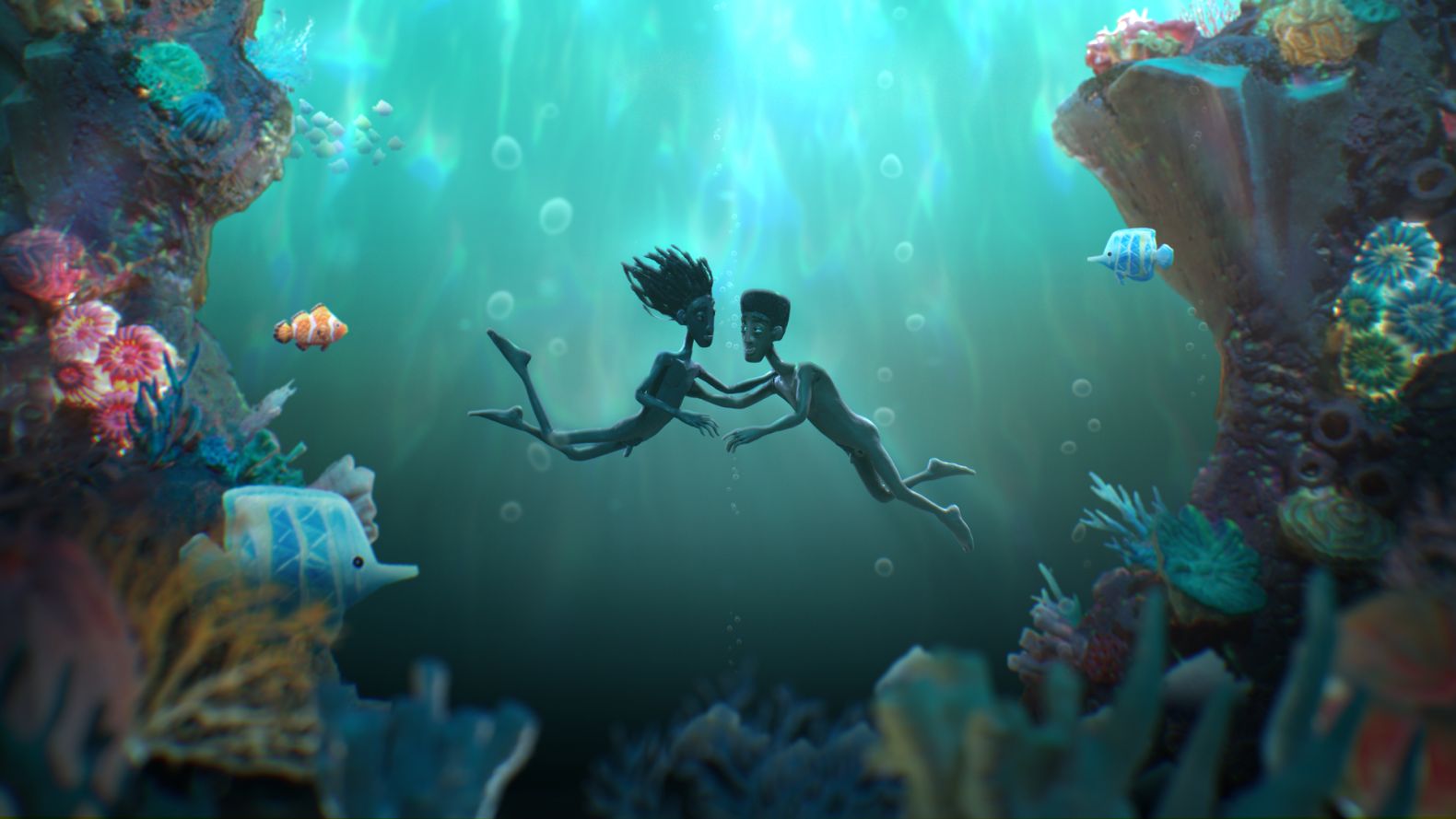 Dula and Edan swim toward each other in an underwater turquoise paradise, surrounded by coral and colorful fish.