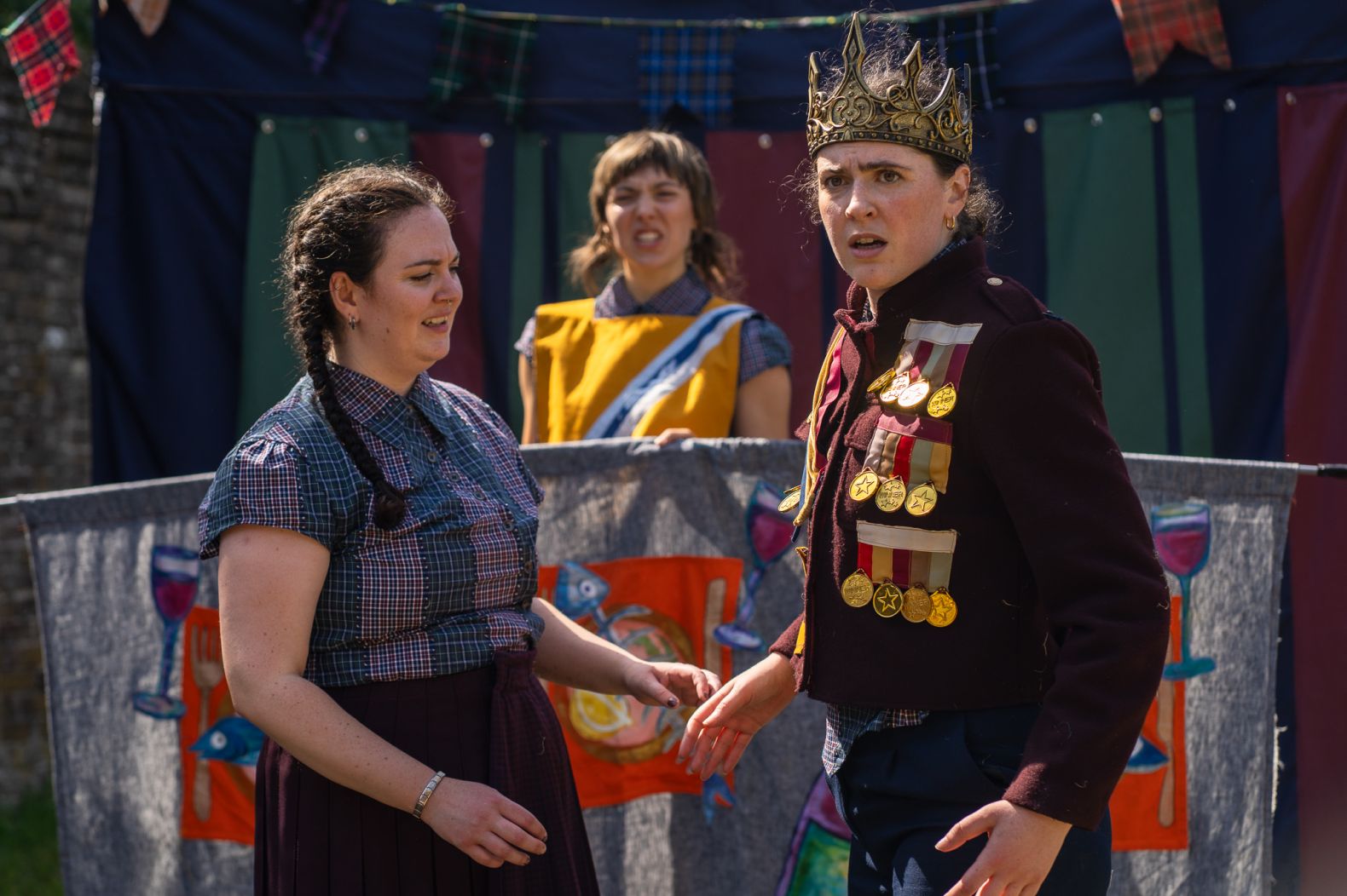 Three members of the Handlebards cast in the show.