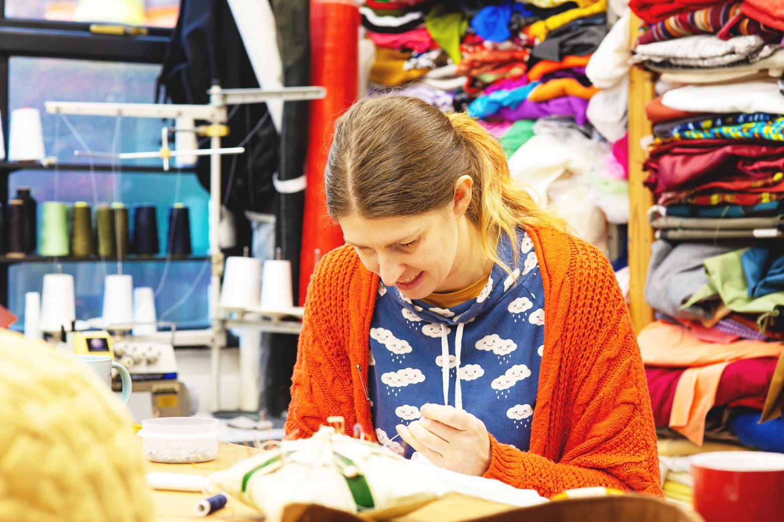 Katie Duxbury sewing costumes. The Borrowers by the Dukes, photo by Gabi Dawkins