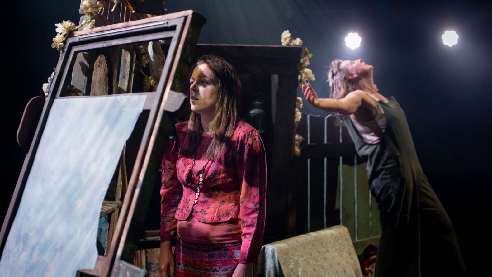 Batty Production Photo: Wildthing is staring into the wall, while Batty is behind stretching her arms out.