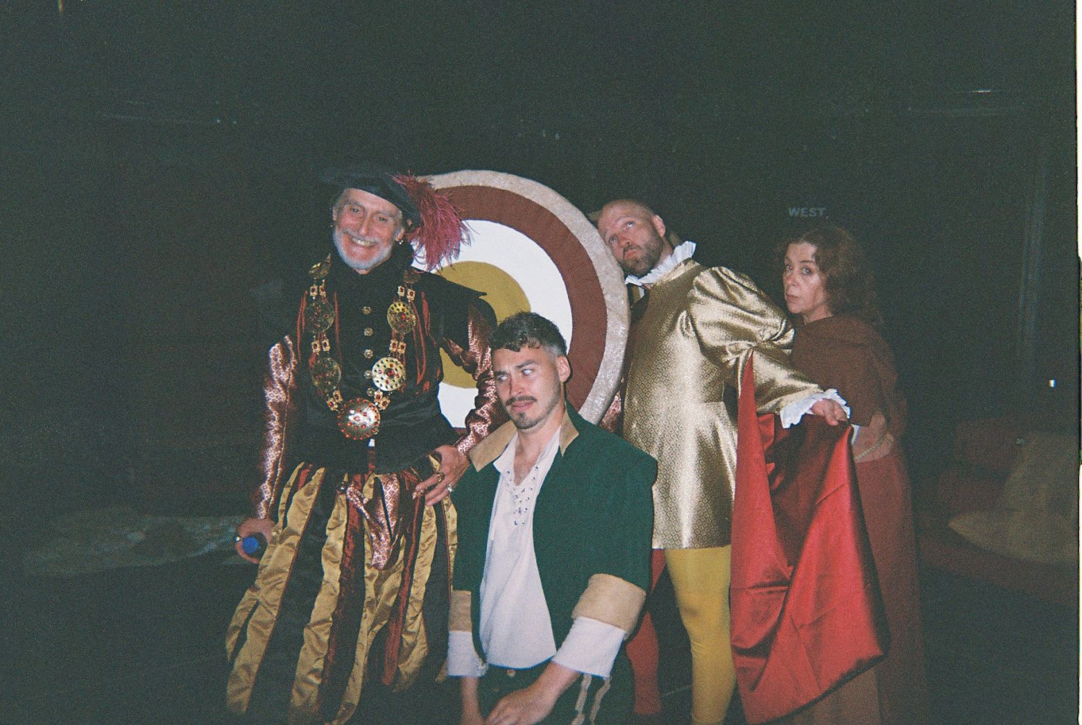 Ian Crowe, Joe Parker, Matthew Ganley and Lisa Howard pose with an archery target 