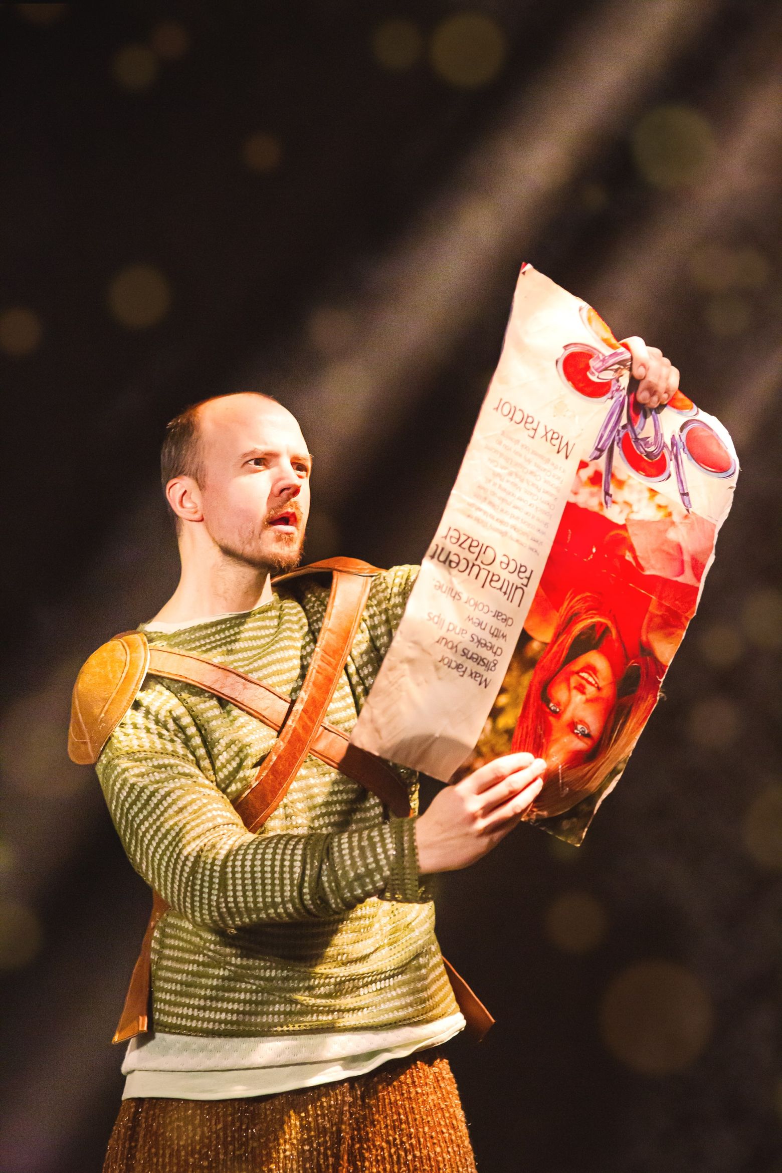 Pod reading giant magazine clipping upside down. The Borrowers by the Dukes, photo by Gabi Dawkins.