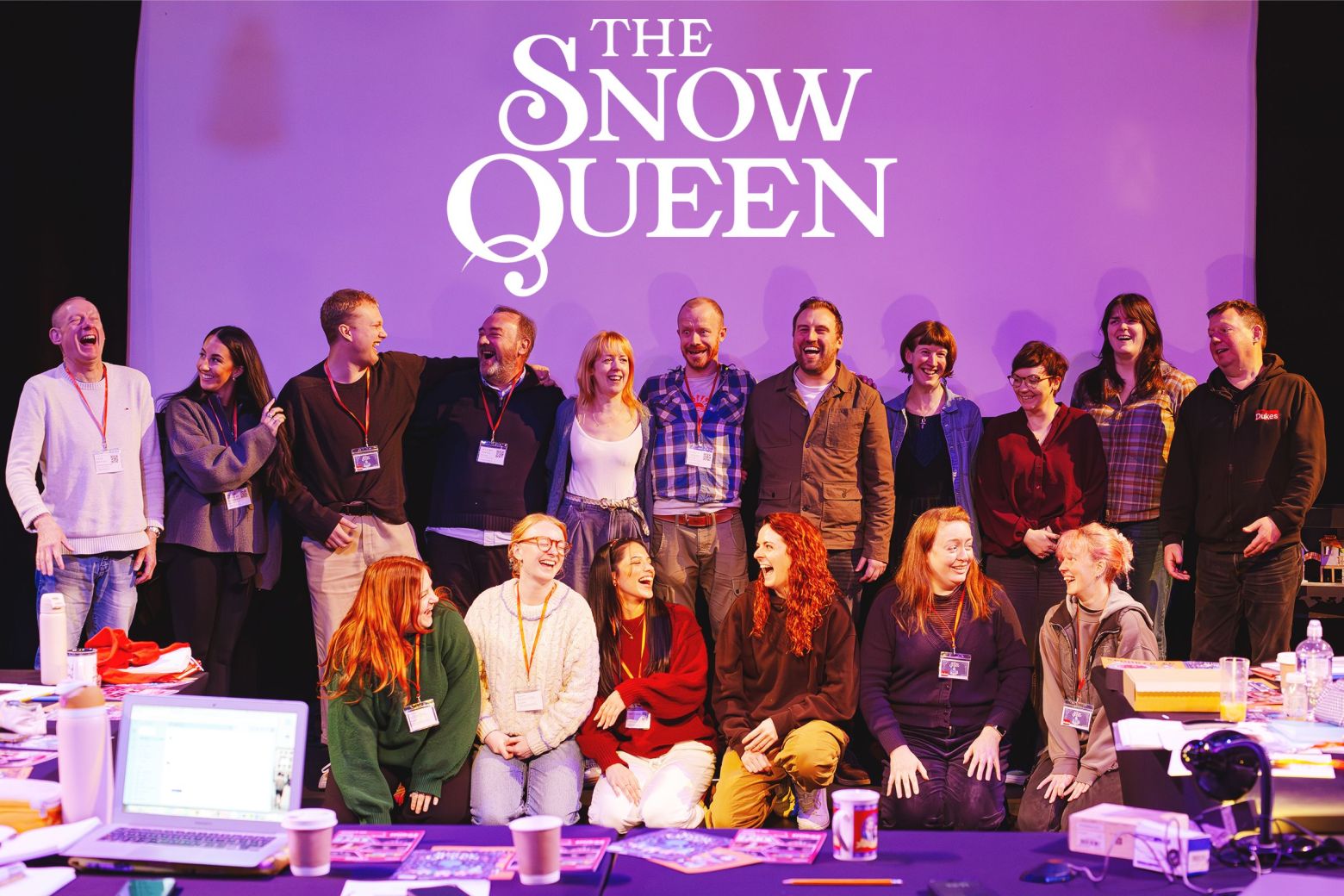 The Snow Queen Cast and Crew laughing in group a photo
