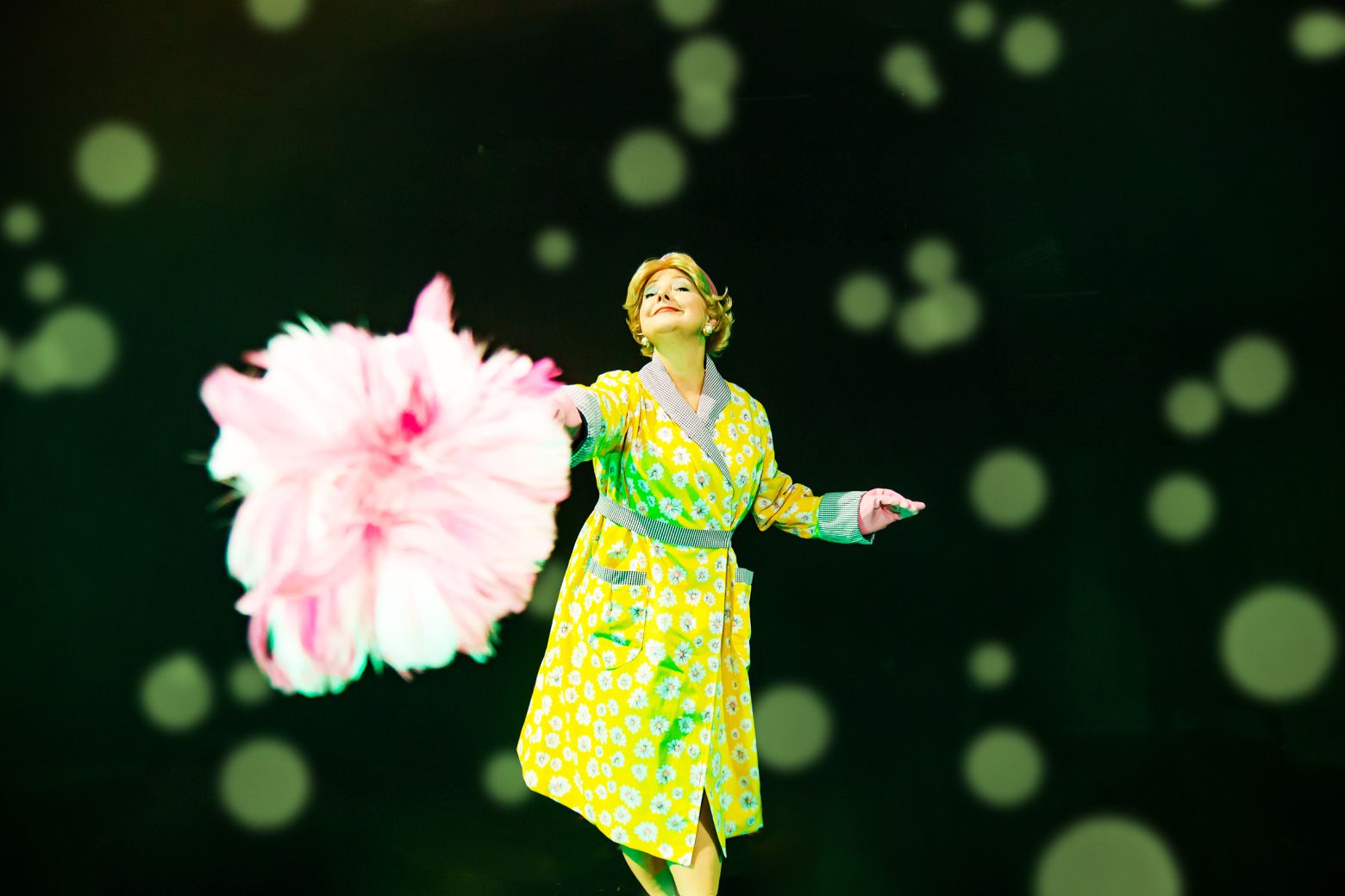 Mrs Driver pointing pink feather duster to camera. The Borrowers by the Dukes, photo by Gabi Dawkins.