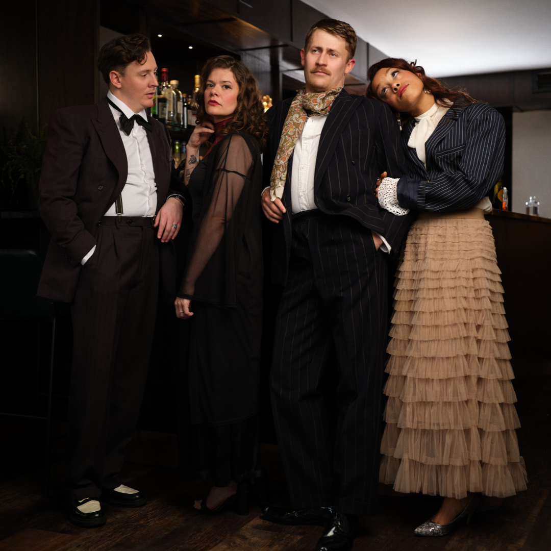 Private Lives: (from left) Victor in a black suit and bow tie; Amanda in a black sheer dress; Elyot in a pin stripe suit and a green and orange scarf; Sybil in a pin stripe coat and cream skirt.